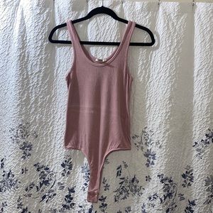 One piece with buttons on hooha area